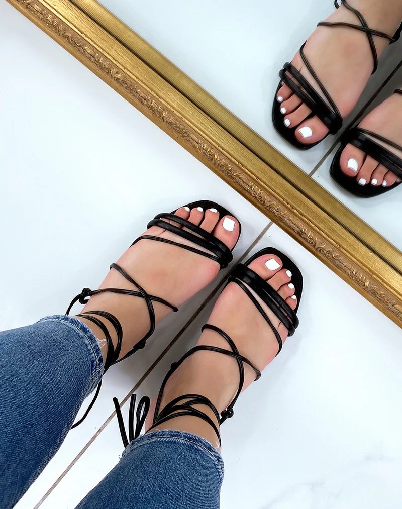 Nu-pieds noirs à multiples brides à semelle en jute