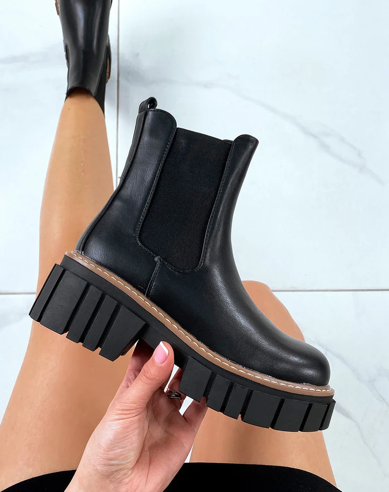 Chelsea boots noires à semelle décorée d’un liseré marron