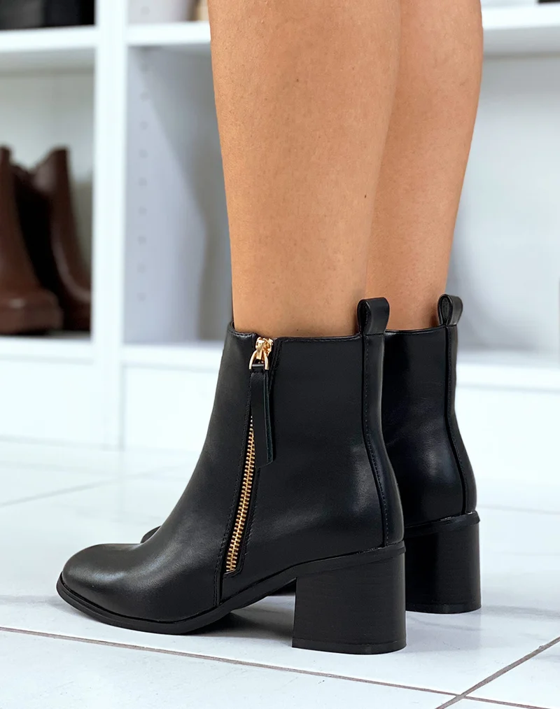 Bottines noires à zip doré et petit talon