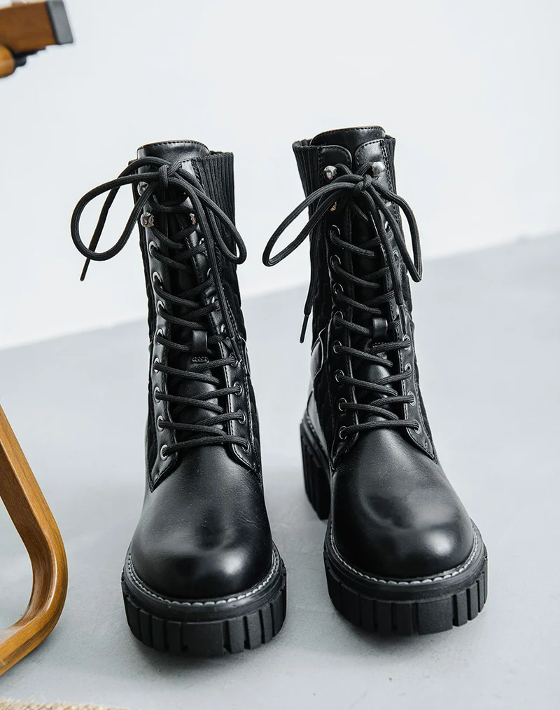 Bottines montantes noires bi-matière à semelle talonnée et crantée