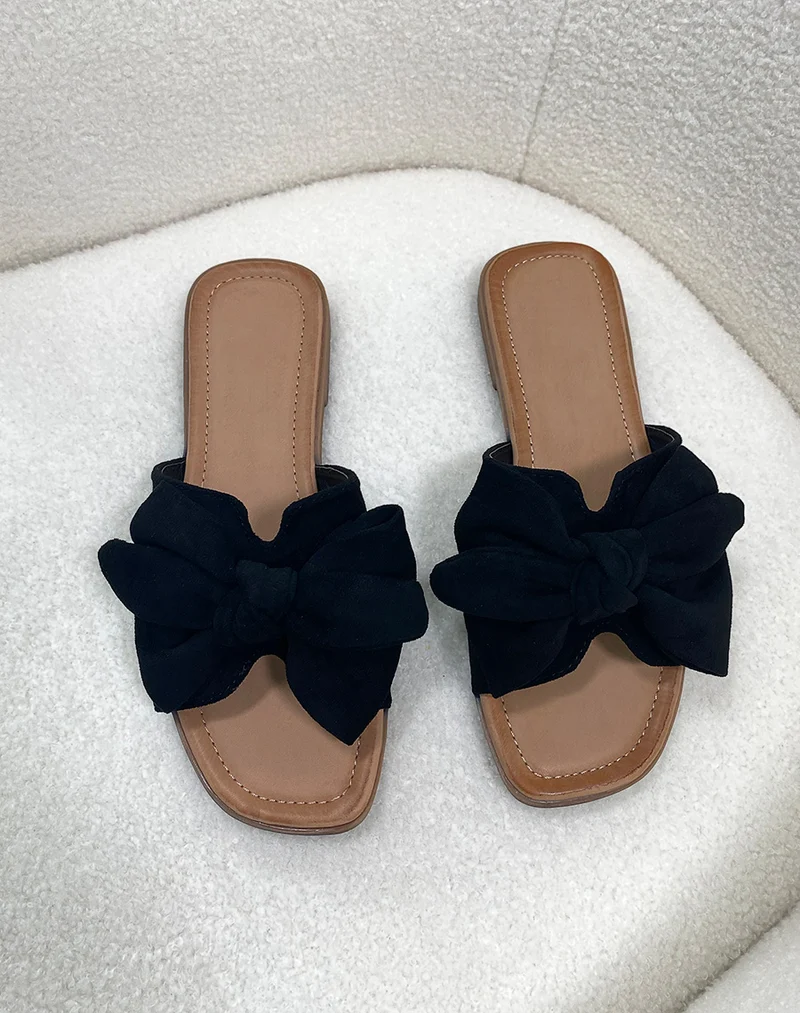 Mules en suédine noire à nœud