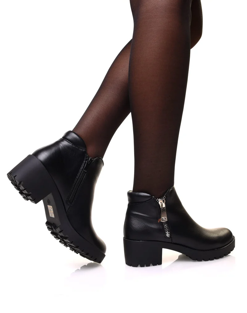 Bottines noires à fermeture éclair décorative et talon mi haut