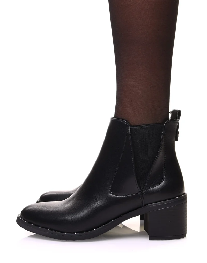 Bottines noires à élastiques échancrés et talon mi haut