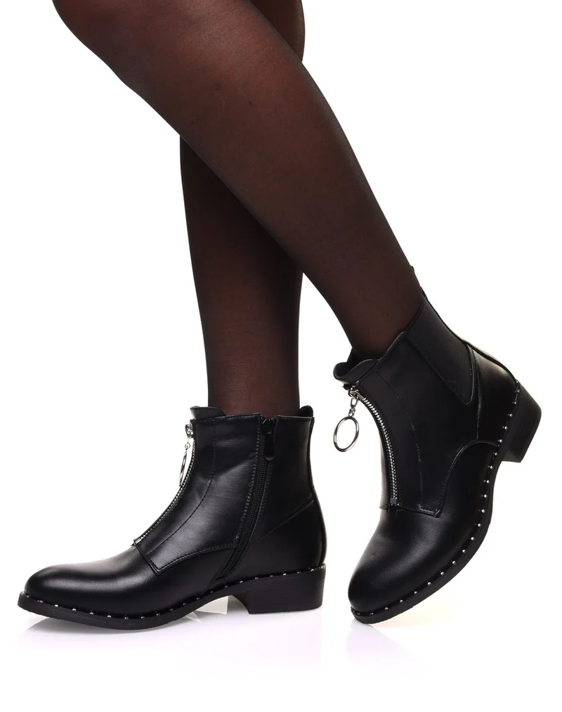 Bottines noires à semelle cloutée et fermeture éclaire décorative à l’avant
