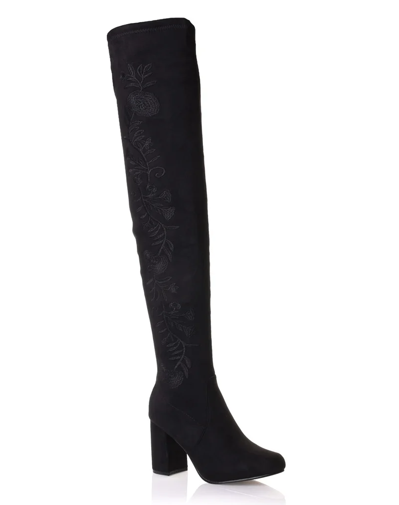 Cuissardes noires brodées à talons hauts