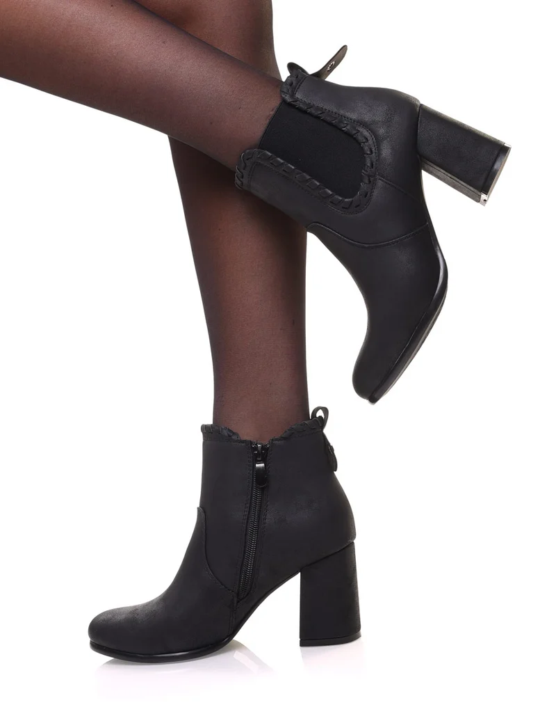 Bottines à talons noires en suédine et détails torsadés