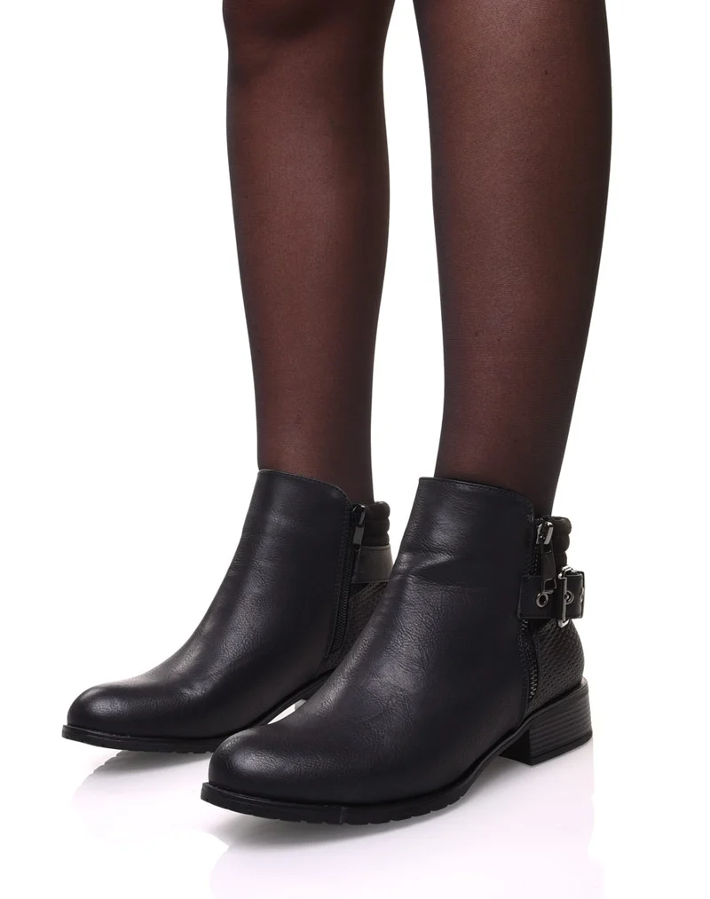 Bottines noires à talons et fermetures zippées