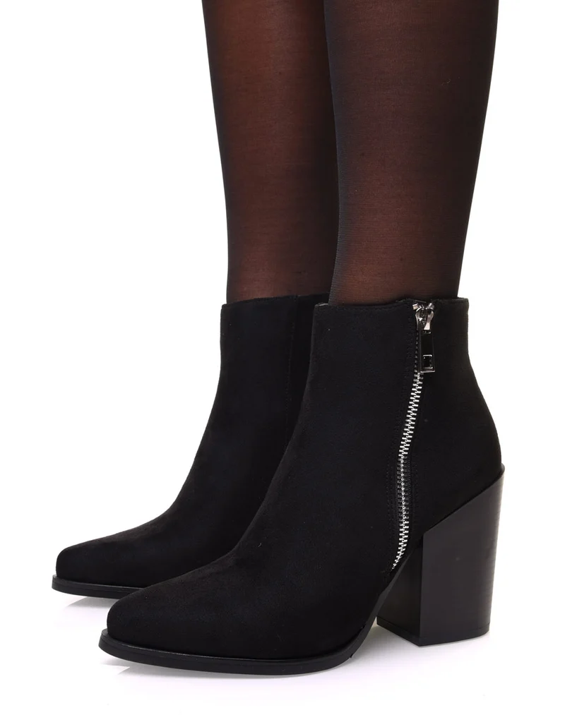 Bottines noires en suédine à bout pointu et talon épais