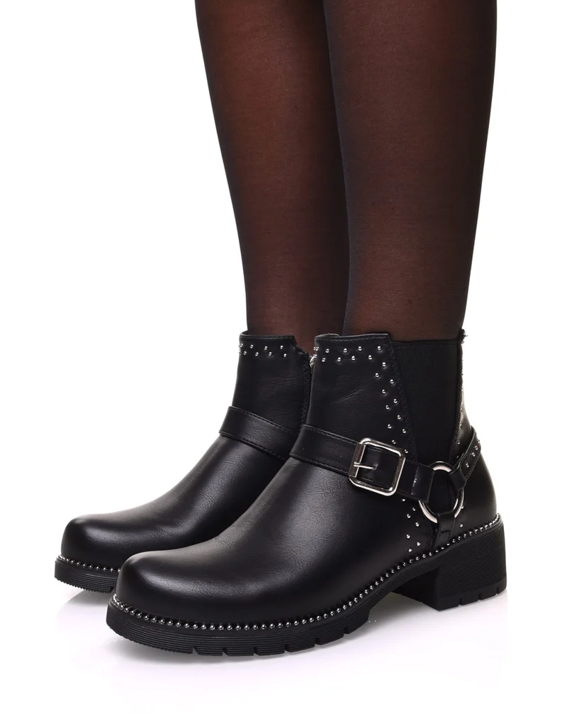 Bottines noires à sangle décorative avec anneau