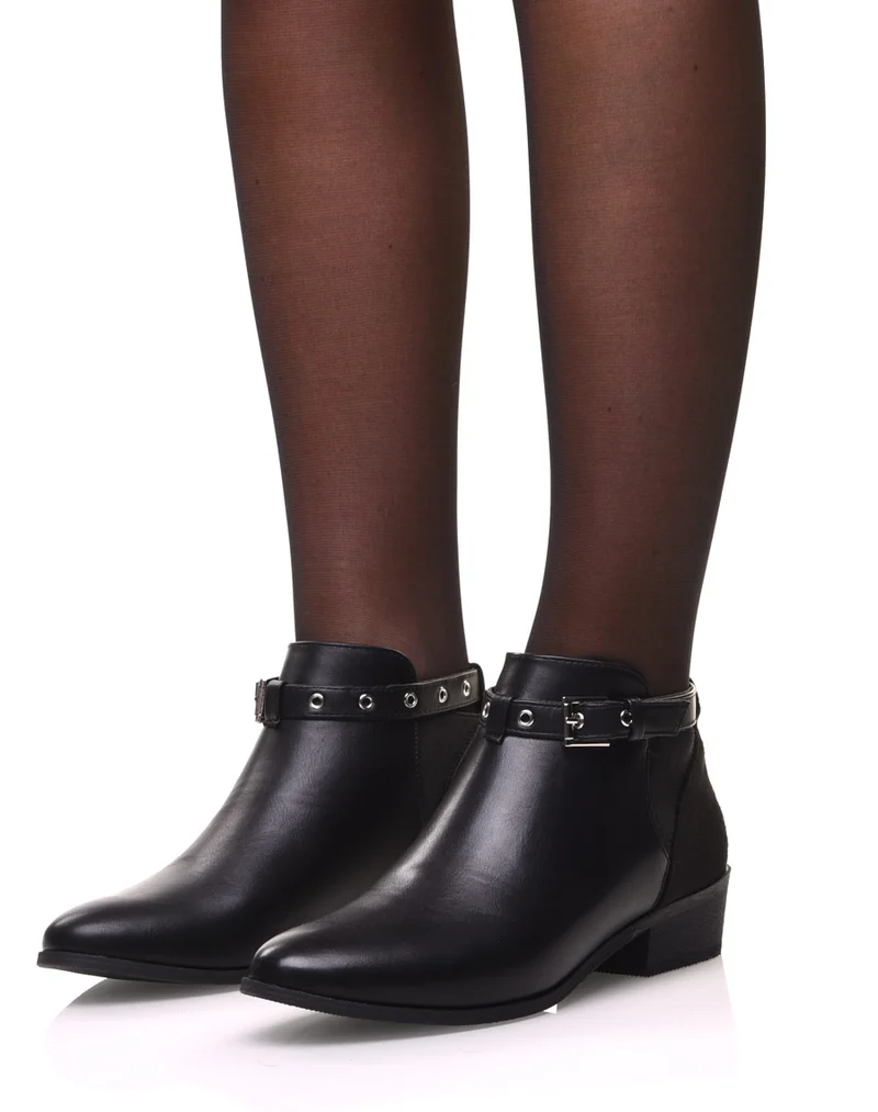 Bottines noires plates lanière ajustable