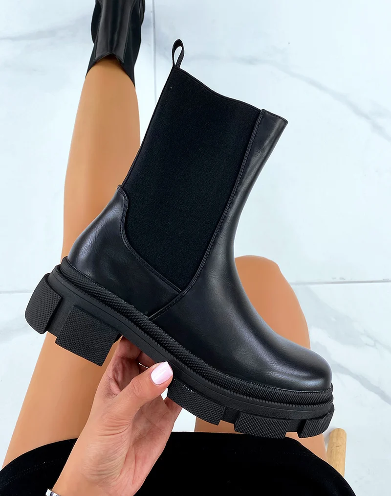 Bottines noires montantes à élastiques et semelle crantée