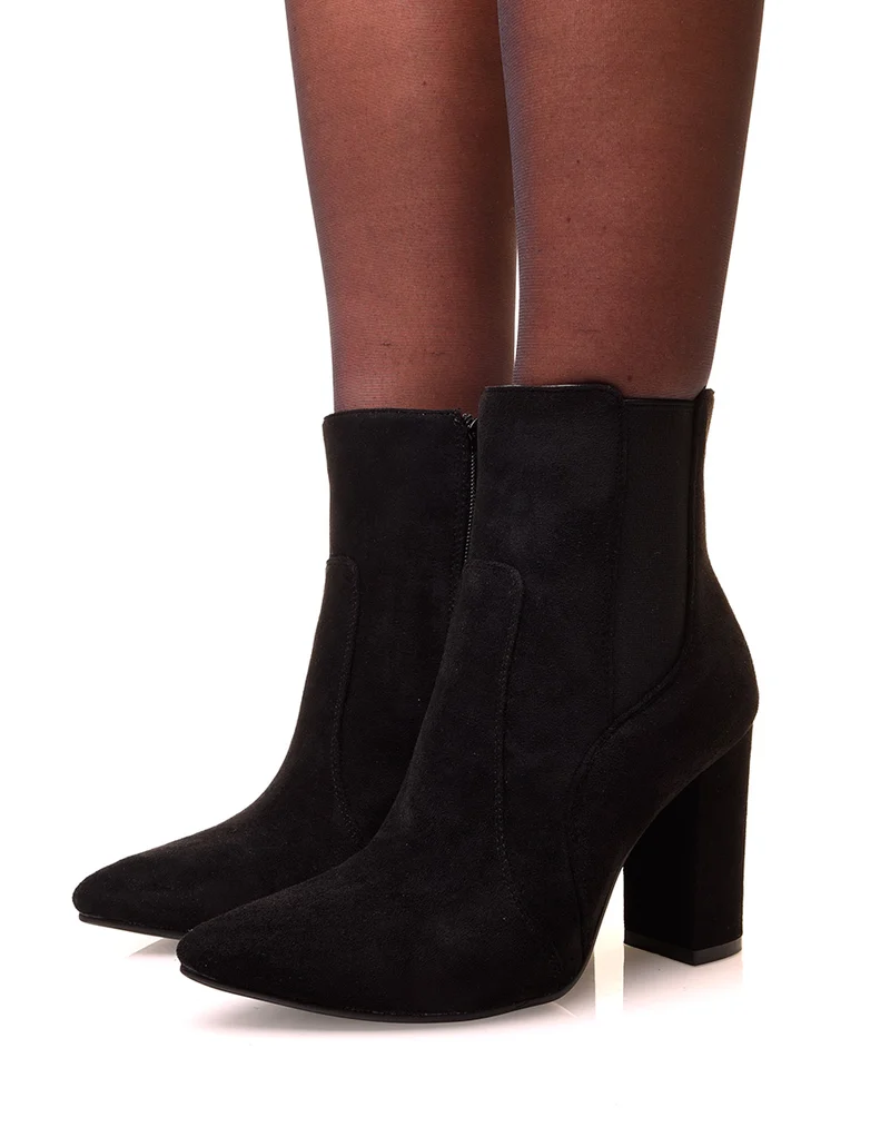 Bottines noires en suédine à talons et bouts pointus