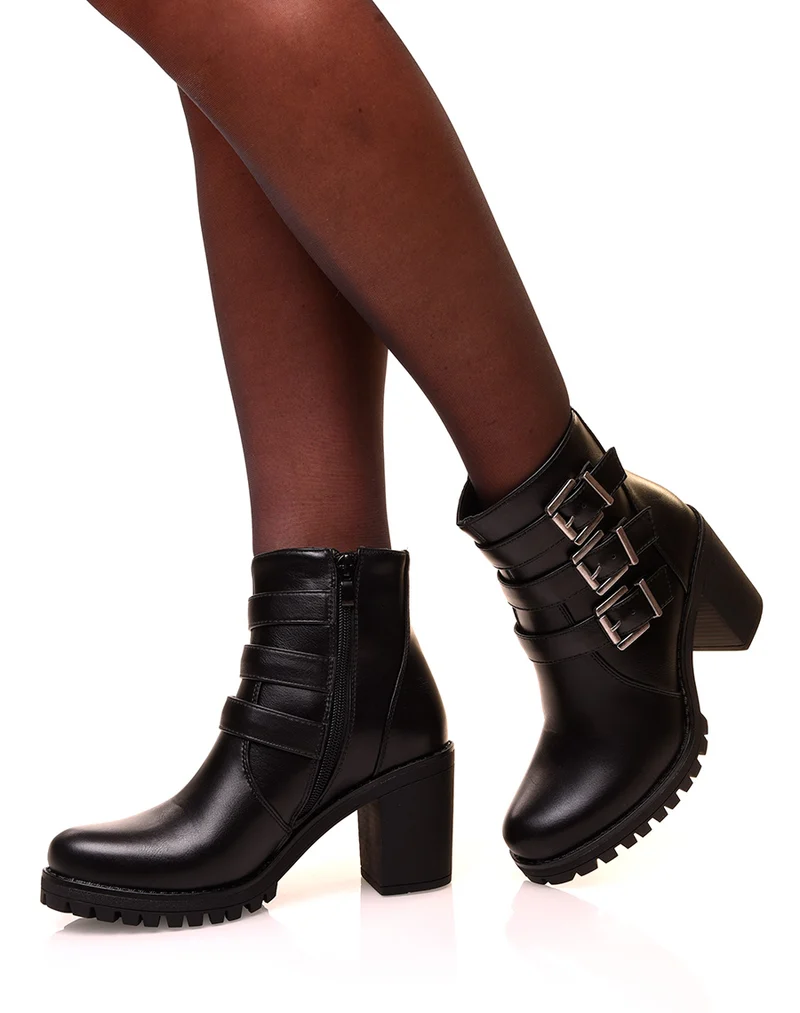 Bottines noires à talons et à sangles