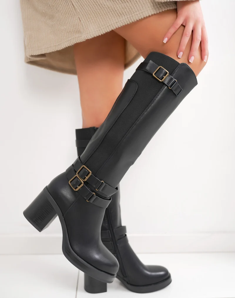 Bottes femme noires fourrées à talon épais, avec boucles dorées et élastique