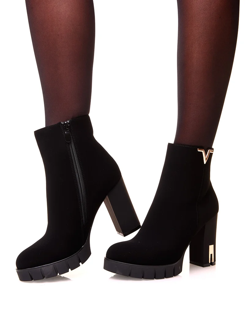 Bottines noires à talons en suédine à détails dorés
