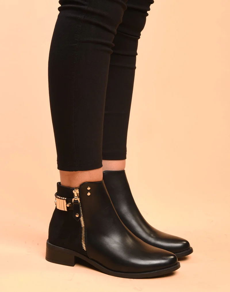 Bottines noires plates bi matières avec détails à l'arrière
