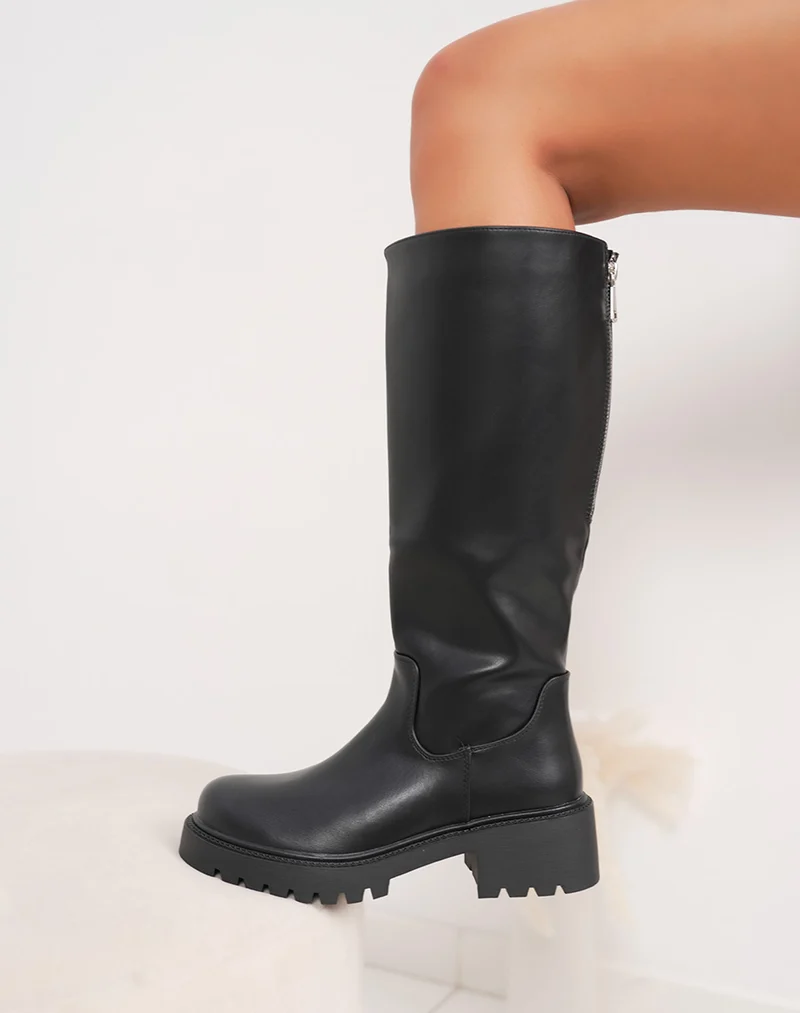 Bottes noires à semelle crantée et zip argenté