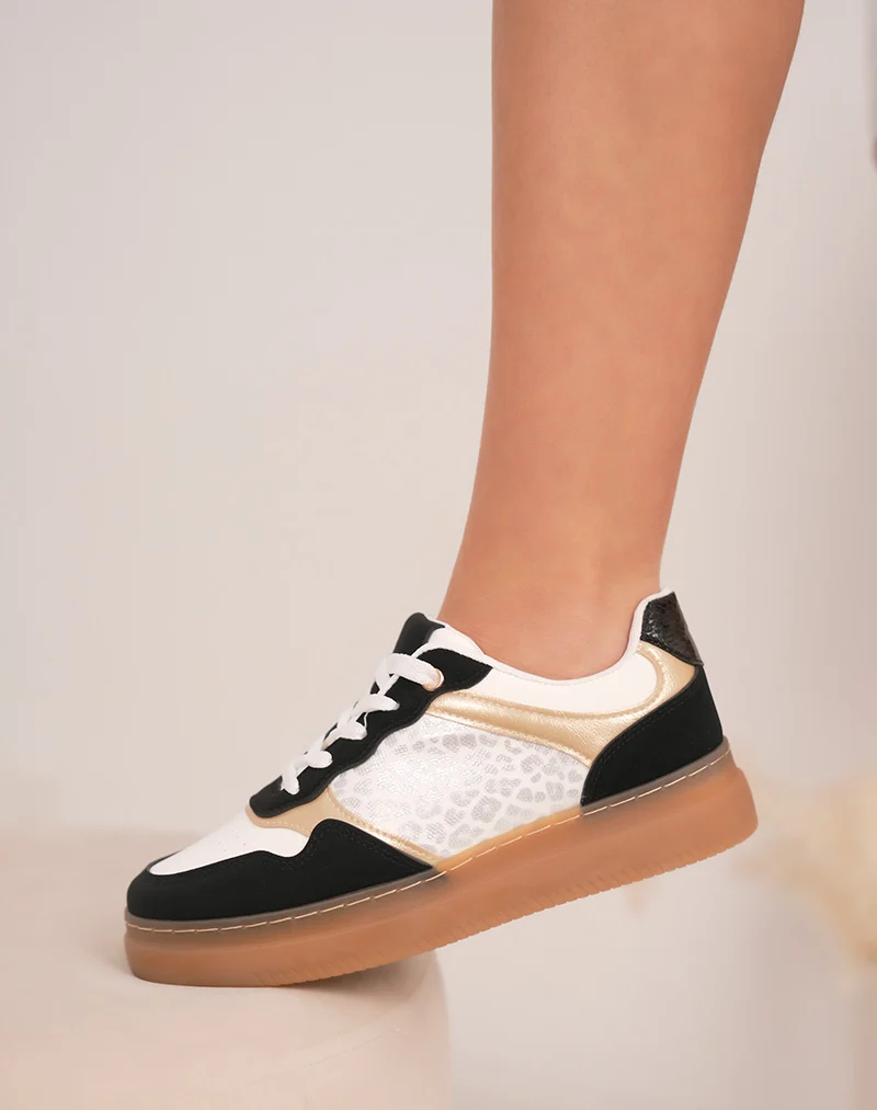Baskets femme noires et blanches élégantes avec effet léopard argenté et détails dorés