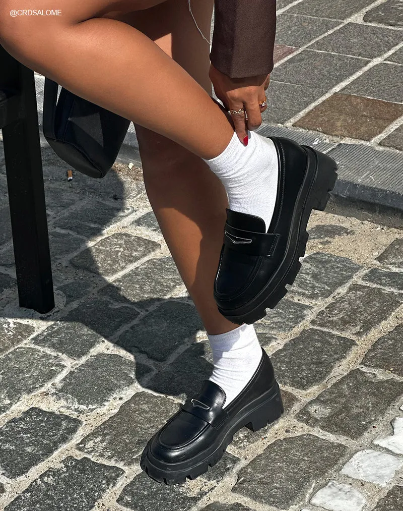 Mocassins femme noirs avec détail argenté et semelle crantée