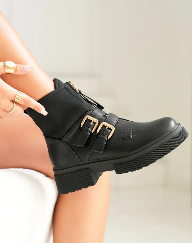 Bottines noires: Zippé et détails dorés
