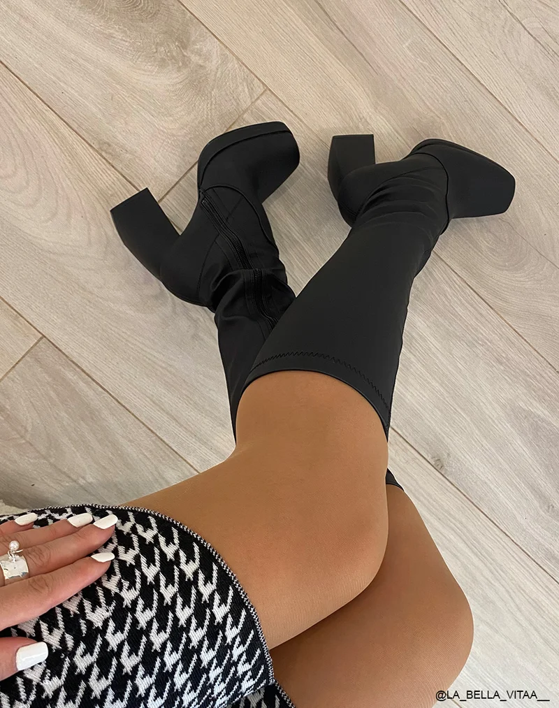 Bottes noires effet chaussettes à talon haut